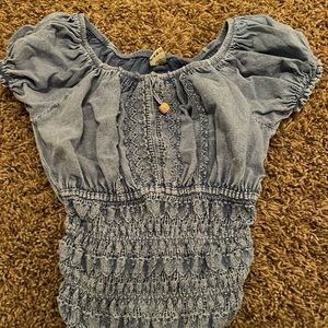 blue cropped shirt stretchy material around bottom